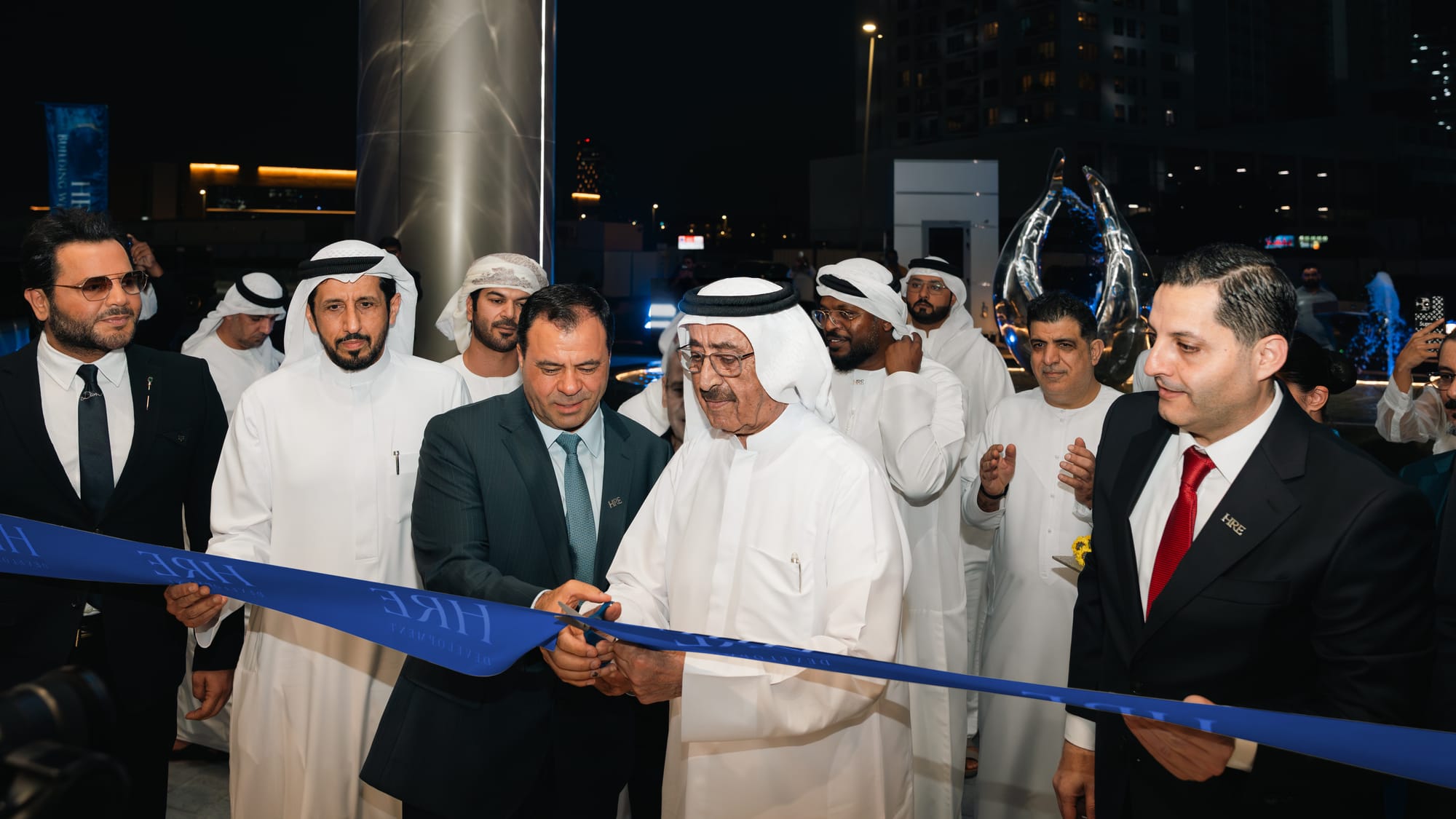 Sheikh Hasher Bin Maktoum Bin Juma Al Maktoum (second from right), Chairman of Dubai Media Incorporated, Mohamed Adib Hijazi (third from right), Chairman of HRE Development, and guests at the handover ceremony