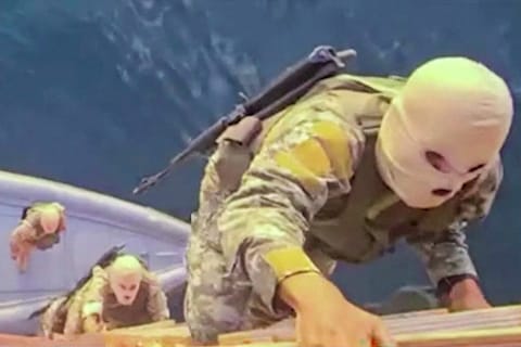 This screen grab from video released by Iran’s Revolutionary Guards (IRGC) and aired by state broadcaster IRIB on April 23, 2026, allegedly shows IRGC naval forces boarding a ship in the Strait of Hormuz.