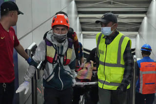 Indonesia's president ordered an investigation Tuesday after a long-distance train smashed into a stationary commuter train overnight, killing seven people and injuring dozens.