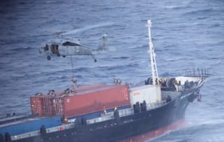 US Marines board the commercial ship M/V Blue Star III in the Arabian Sea, near the Strait of Hormuz.