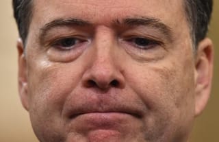 FBI Director James Comey looks on during the House Permanent Select Committee on Intelligence hearing on Russian actions during the 2016 election campaign on March 20, 2017 on Capitol Hill in Washington, DC.