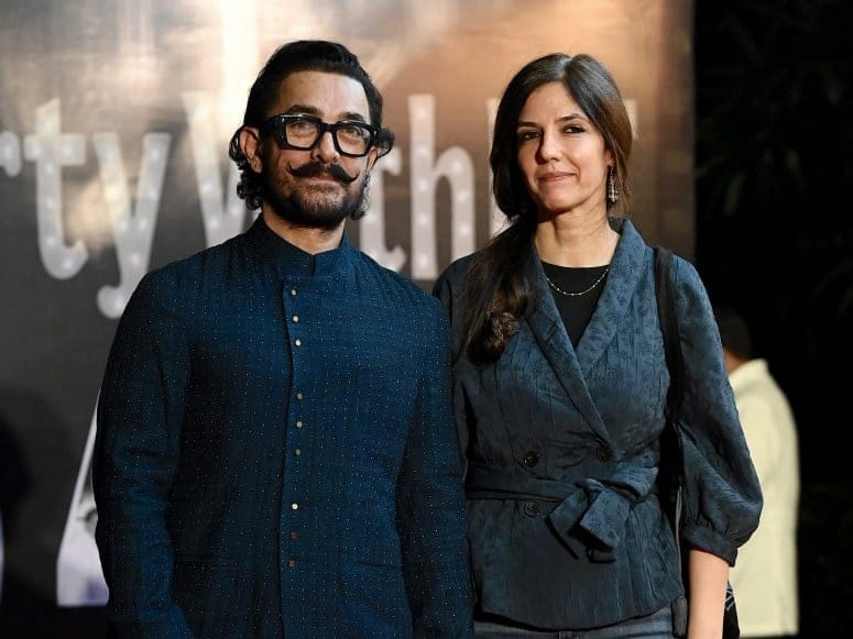 Bollywood actor Aamir Khan (L), along with his girlfriend Gauri Spratt, attends the film producer Ramesh Taurani’s 65th birthday celebrations in Mumbai on January 17, 2026.