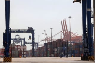A picture taken March 1, 2022 shows a view of cranes and shipping containers at a loading dock of Jeddah's Islamic Seaport on Saudi Arabia's western Red Sea coast.