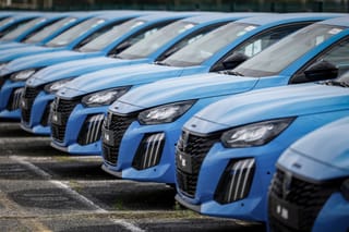 Peugeot cars are seen parked outside the Stellantis multinational car manufacturer's plant in Poissy, west of Paris, on April 15, 2026.