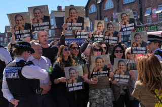 Protesters hold posters near the scene where two people were stabbed yesterday in the Golders Green neighbourhood, that has a large Jewish community, in London, Thursday, April 30, 2026.(AP Photo/Alastair Grant) (Photo: AP)