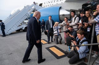 President Donald Trump speaks to journalists before boarding Air Force One at Palm Beach International Airport on May 2, 2026 in Palm Beach, Florida.