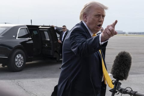 President Donald Trump speaks to journalists before boarding Air Force One at Palm Beach International Airport on May 2, 2026 in Palm Beach, Florida.