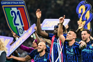 Inter Milan's French forward #9 Marcus Thuram and Inter Milan's Argentinian forward #10 Lautaro Martinez celebrate with teammates after winning their 21st 'scudetto' following the Italian Serie A football match between Inter Milan and Parma at San Siro stadium in Milan, on May 3, 2026.
