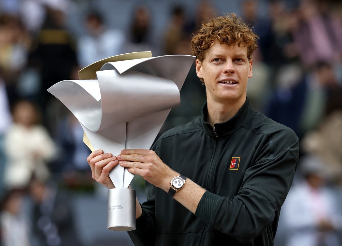 Italy's Jannik Sinner celebrates with the trophy after winning the 2026 ATP Tour Madrid Open tennis tournament final singles match against Germany's Alexander Zverev at the Caja Magica in Madrid, on May 3, 2026.
