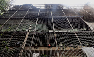 A view of the four-storey residential building in the Vivek Vihar area after a massive fire breaks out resulting in nine deaths and some injuries, in New Delhi on Sunday.  