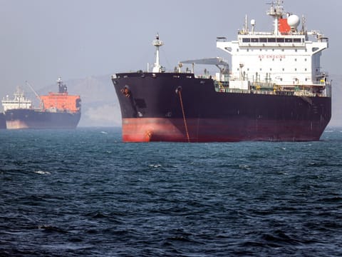 A ceasefire between Iran and the United States was teetering Monday as the two countries traded fire over the strategic Strait of Hormuz and the United Arab Emirates reported attacks for the first time since the truce was declared nearly a month ago.