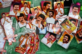 A vendor sells pictures of Indian actor and Tamilaga Vettri Kazhagam (TVK) party president C. Joseph Vijay during vote counting for the Tamil Nadu Legislative Assembly elections, at the party headquarters in Chennai on May 4, 2026.