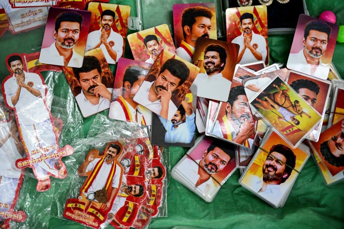 A vendor sells pictures of Indian actor and Tamilaga Vettri Kazhagam (TVK) party president C. Joseph Vijay during vote counting for the Tamil Nadu Legislative Assembly elections, at the party headquarters in Chennai on May 4, 2026.