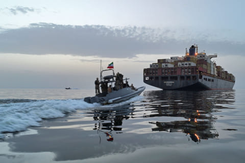 This photo obtained by AFP from the Iranian news agency Tasnim shows an Islamic Revolutionary Guard Corps (IRGC) boat allegedly taking part in an operation to seize ships attempting to cross the Strait of Hormuz, on April 21, 2026. Oil prices had been climbing earlier as investors worried about a lack of progress in ending the Middle East crisis, with Tehran keeping the Strait of Hormuz closed and the US maintaining a blockade of Iranian ports.