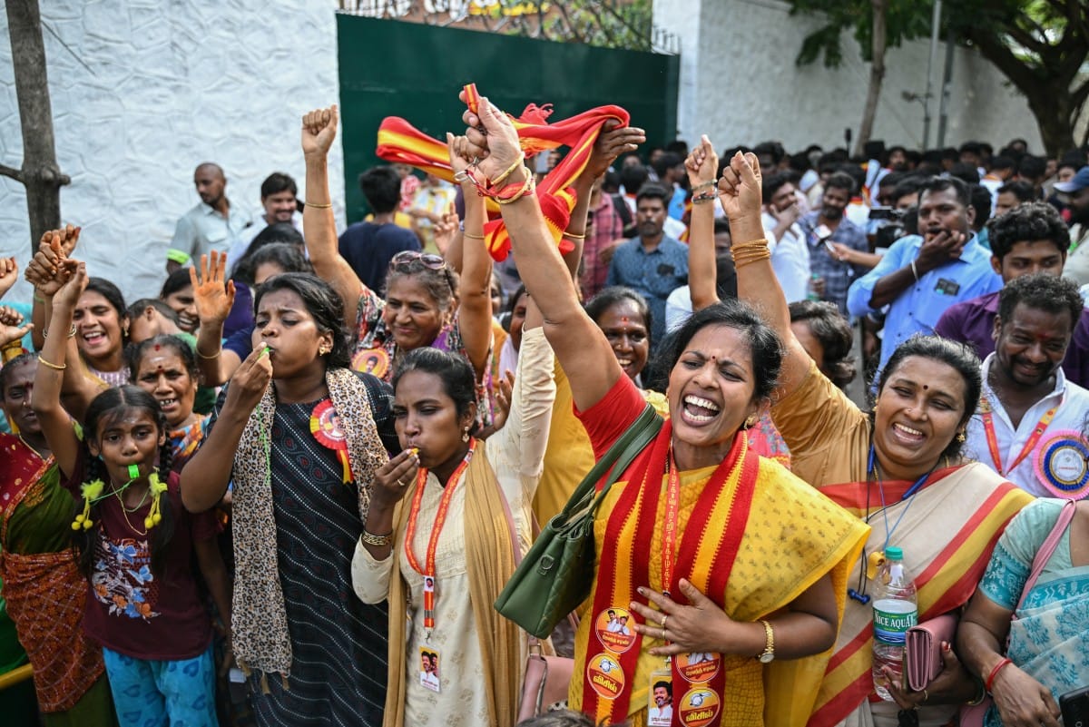 Supporters and members of Indian actor C. Joseph Vijay's Tamilaga Vettri Kazhagam (TVK) party celebrate after TVK leads in the vote counting for the Tamil Nadu Legislative Assembly elections in Chennai on May 4, 2026.