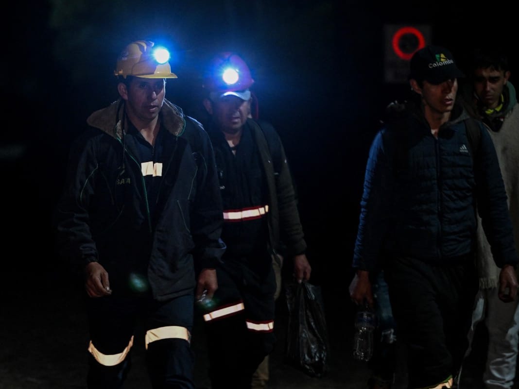 Miners walk around the site of an explosion at a coal mine in Sutatausa, Cundinamarca department, Colombia on May 4, 2026.