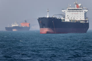 Oil tankers sit at anchor offshore in the Strait of Hormuz off Bandar Abbas, Iran, Saturday, May 2, 2026. (Amirhosein Khorgooi/ISNA via AP)