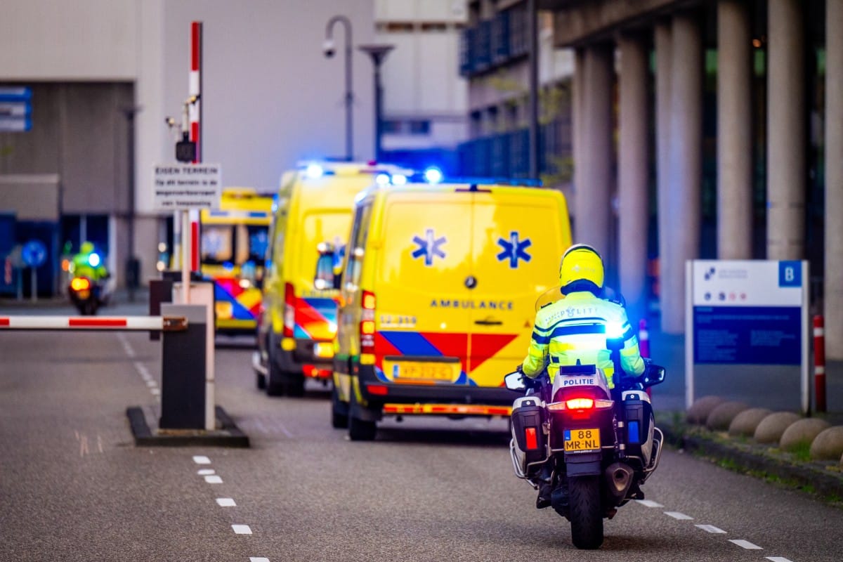 This photograph shows a view of a convoy of ambulances allegedly carrying at least one of the passengers from the cruise ship MV Hondius believed to be infected with hantavirus escorted by Dutch police on motorcycles as it arrives near Leiden University Medical Center (LUMC) in Leiden on May 6, 2026.