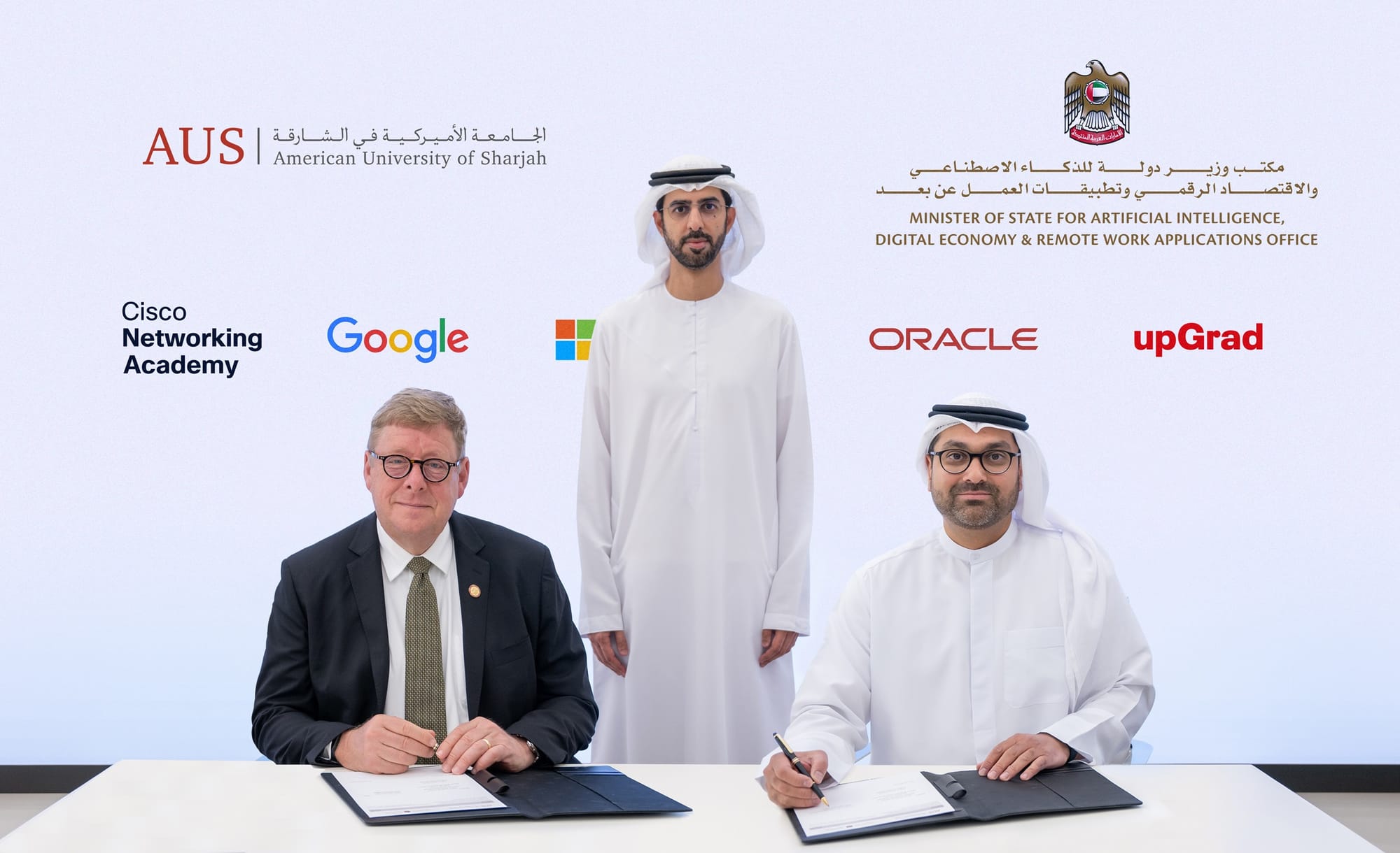 Dr Tod Laursen and Saqr Binghalib during the MoU signing ceremony in the presence of Omar Sultan Al Olama.