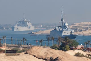 A handout picture released by the Marine Nationale (French Navy) on May 6, 2026 shows the French Navy's Carrier Strike Group that includes the flagship aircraft carrier Charles de Gaulle (unseen) and its escort transiting the Suez Canal en route to the southern Red Sea to pre‑position for a possible mission to restore navigation in the Strait of Hormuz.