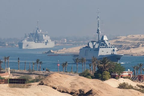 A handout picture released by the Marine Nationale (French Navy) on May 6, 2026 shows the flight deck of the French Navy's flagship aircraft carrier Charles de Gaulle transiting the Suez Canal en route to the southern Red Sea to pre-position for a possible mission to restore navigation in the Strait of Hormuz. 