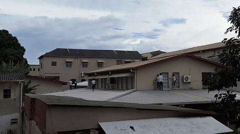 Students of Instituto Sao Jose school in northeast Brazil take shelter on the roof during a rampage by a teen shooter, who killed two staff members and injured two other people, including an 11-year-old girl.
