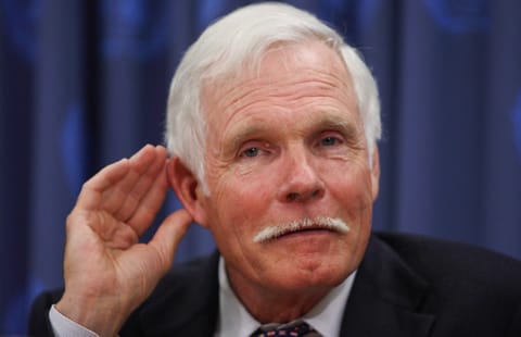 Ted Turner, Chairman of Turner Enterprises and the UN Foundation, listens to a question during a news conference. File photo taken on April 1, 2008 at the United Nations in New York.