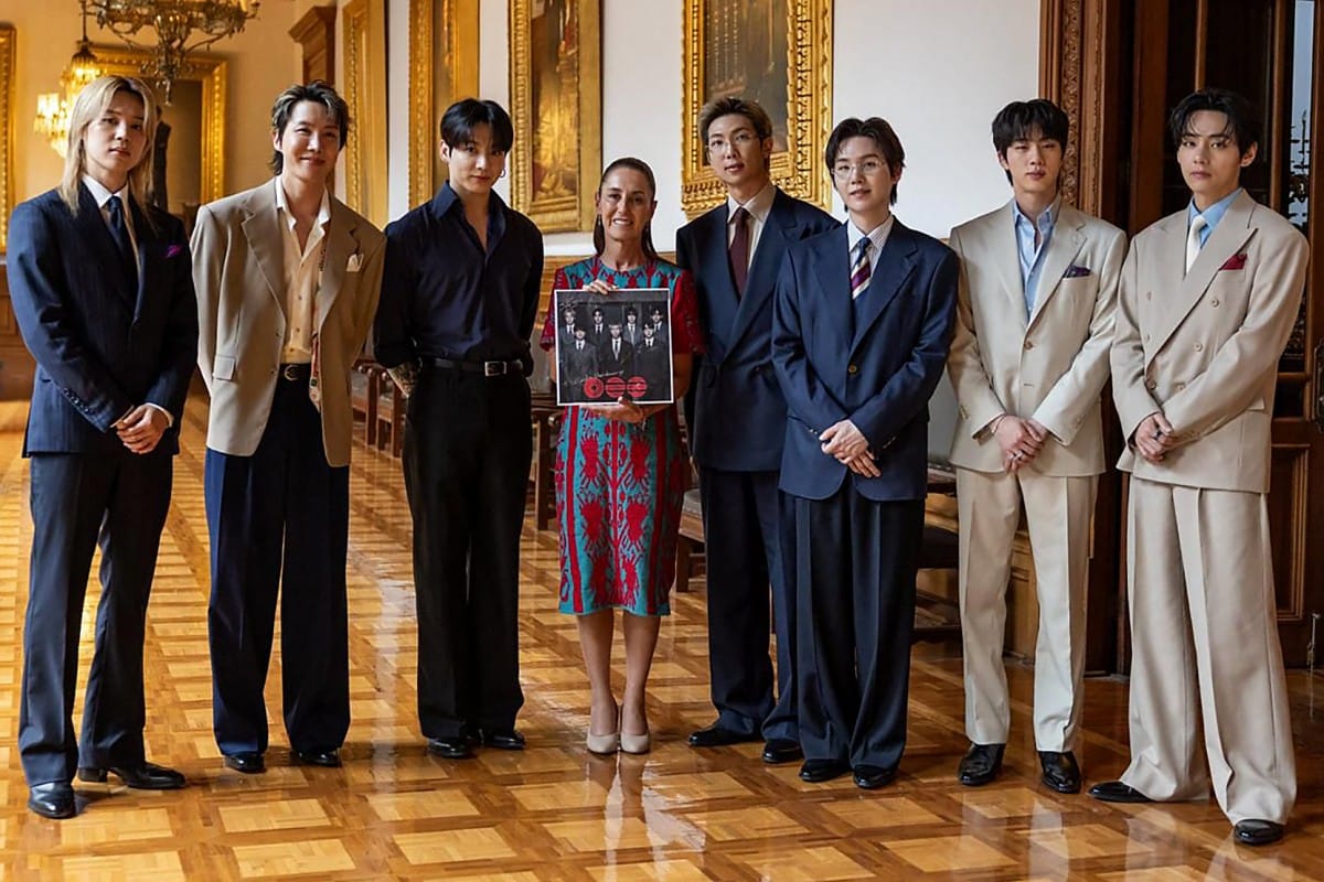 Handout picture released by Mexico's presidency press office showing Mexico’s President Claudia Sheinbaum with South Korea's K-pop band BTS at the Palacio Nacional in Mexico City on May 6, 2026.