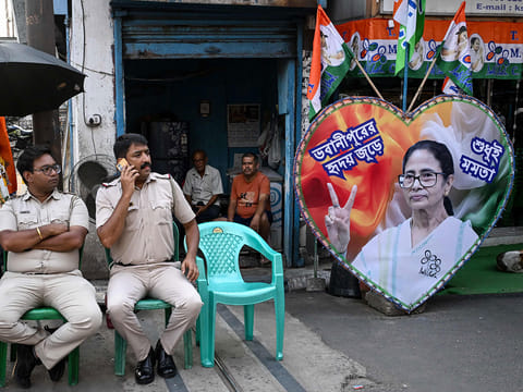 Police personnel guard the road leading towards the residence of West Bengal Chief Minister and All India Trinamool Congress (TMC) party chairperson Mamata Banerjee in Kolkata on May 5, 2026 after her party lost the recently concluded state legislative assembly elections. 