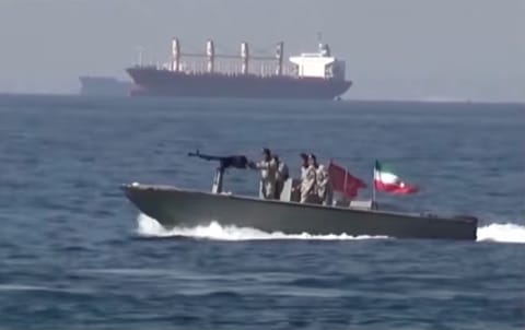 An Iranian fast-attack boat near on the Strait of Hormuz. The Iranian regime imposed its Hormuz blockade post-original truce, making attempts to seizing ships, denying "unauthorised" passage to commercial vessels, even as the US Navy imposes its own maritime blockade on Iran, resulting in a "dual blockade" of the Hormuz Strait.