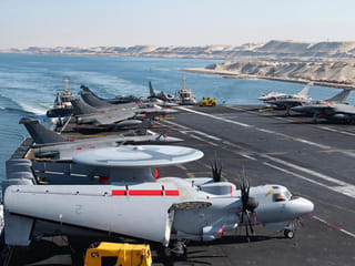 A handout picture released by the Marine Nationale (French Navy) on May 6, 2026 shows the flight deck of the French Navy's flagship aircraft carrier Charles de Gaulle transiting the Suez Canal en route to the southern Red Sea to pre-position for a possible mission to restore navigation in the Strait of Hormuz. 