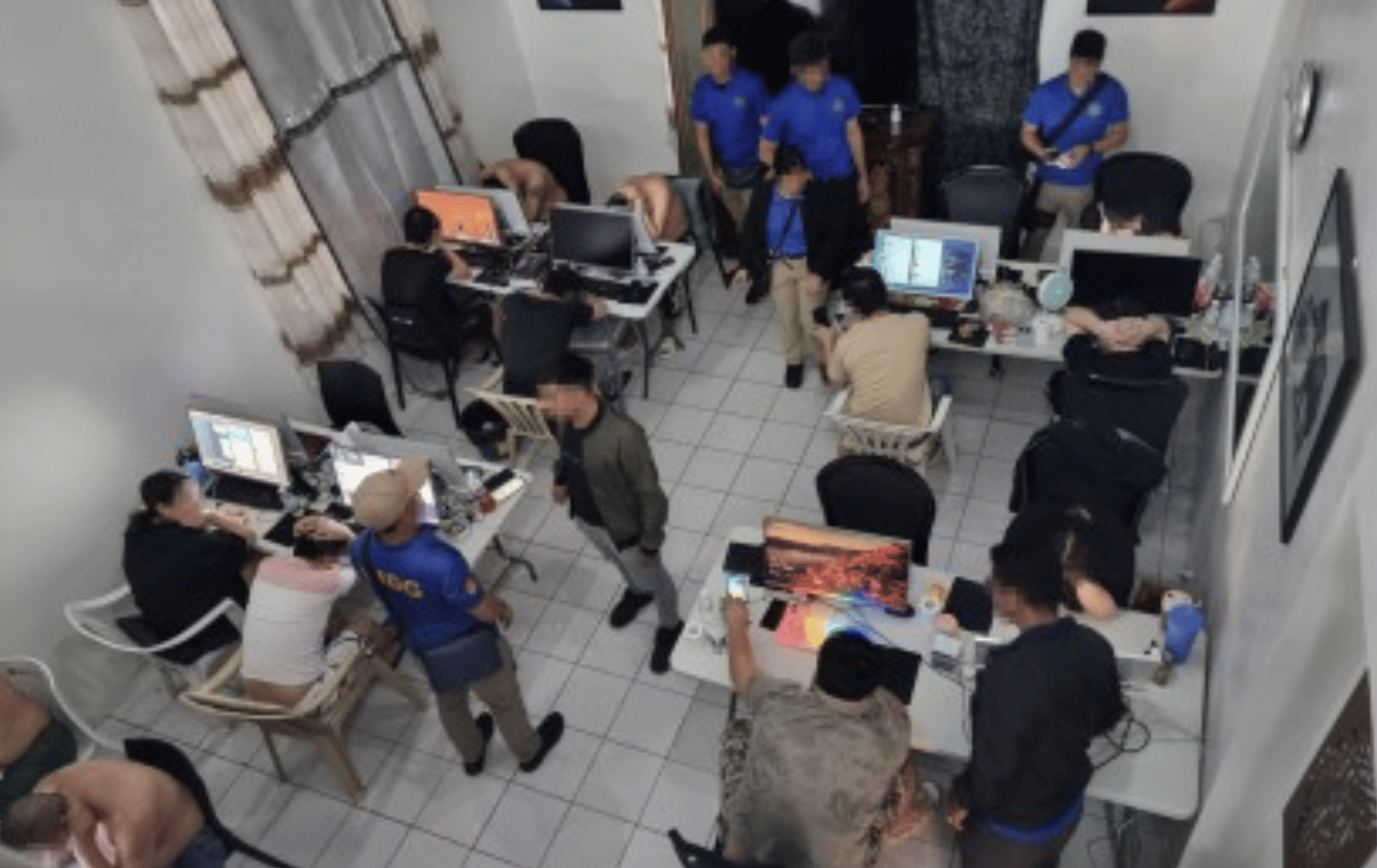 A scene of a Philippine police raid on a text scam hub in Subic, Zambales. File photo taken on September 4, 2024. Philippine police has ramped up its drive against illegal text blasters from shuttered offshore gaming ops, sold guerrilla-style online.
