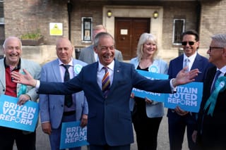 Reform UK leader Nigel Farage reacts in front of Reform UK members outside Havering Town Hall a day after local elections in east London on May 8, 2026.