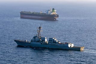 This US Navy handout photo released on May 7, 2026 by US Central Command Public Affairs, shows the Arleigh Burke-class guided-missile destroyer USS Rafael Peralta (DDG 115) implementing a maritime blockade against the Iran-flagged crude oil tanker vessel Stream while the latter was attempting to sail toward an Iranian port, on April 26, 2026.