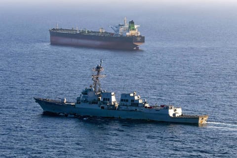 This US Navy handout photo released on May 7, 2026 by US Central Command Public Affairs, shows the Arleigh Burke-class guided-missile destroyer USS Rafael Peralta (DDG 115) implementing a maritime blockade against the Iran-flagged crude oil tanker vessel Stream while the latter was attempting to sail toward an Iranian port, on April 26, 2026.