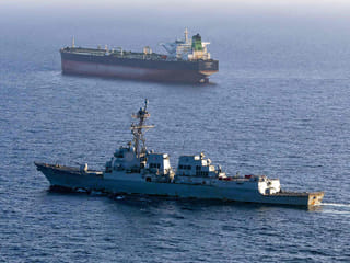 The Arleigh Burke-class guided-missile destroyer USS Rafael Peralta (DDG 115) implementing a maritime blockade against the Iran-flagged crude oil tanker vessel Stream while the latter was attempting to sail toward an Iranian port. 