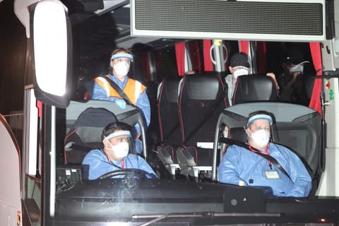 British Nationals, repatriated after a prolonged stay on a cruise ship hit by a deadly hantavirus outbreak, arrive by coach at Arrowe Park Hospital in Wirral, north west England, on May 10, 2026, where they are expected to stay for up to 72 hours.