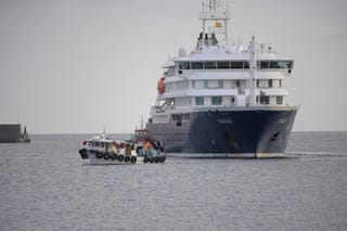 US passengers from the Dutch flagged hantavirus-stricken cruise ship MV Hondius are transferred by boat to the industrial port of Granadilla de Abona on the island of Tenerife in Spain's Canary Islands on May 10, 2026.