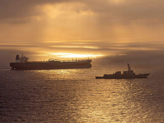 Arleigh Burke-class guided-missile destroyer USS Rafael Peralta (DDG 115) implementing a maritime blockade against the Iran-flagged crude oil tanker vessel Herby