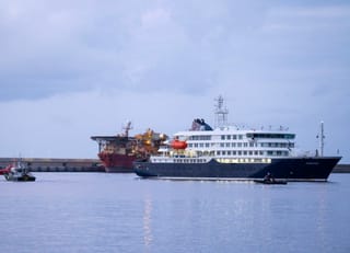 The Dutch-flagged hantavirus-stricken cruise ship MV Hondius arrives at the industrial port of Granadilla de Abona on the island of Tenerife in Spain's Canary Islands to start evacuation of passengers and most crew members on Sunday, May 10, 2026.