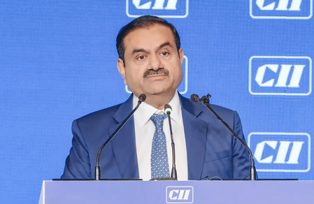 Penalty payment comes as US prosecutors are reported to be set to drop charges against Adani.