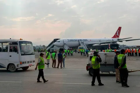 A Turkish Airlines aircraft is seen after passengers were safely evacuated following a fire on the jet while landing in Kathmandu.