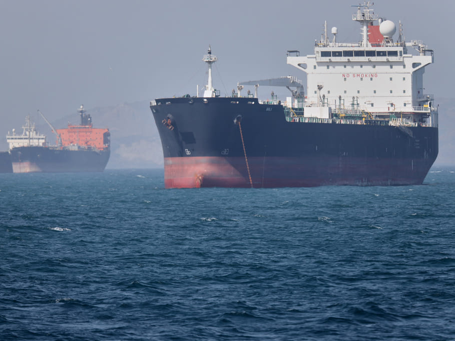 Oil tankers sit at anchor offshore in the Strait of Hormuz off Bandar Abbas, Iran, Saturday, May 2, 2026.