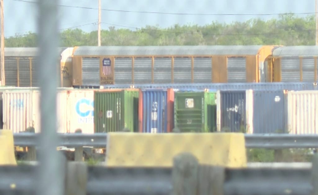Heat stroke is suspected among 6 found dead in a shipping container at a rail yard near Texas border