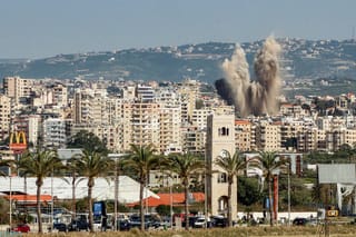 An explosion erupts in the area of Al Housh following Israeli bombardment as seen from Tyre in southern lebanon on May 12, 2026.