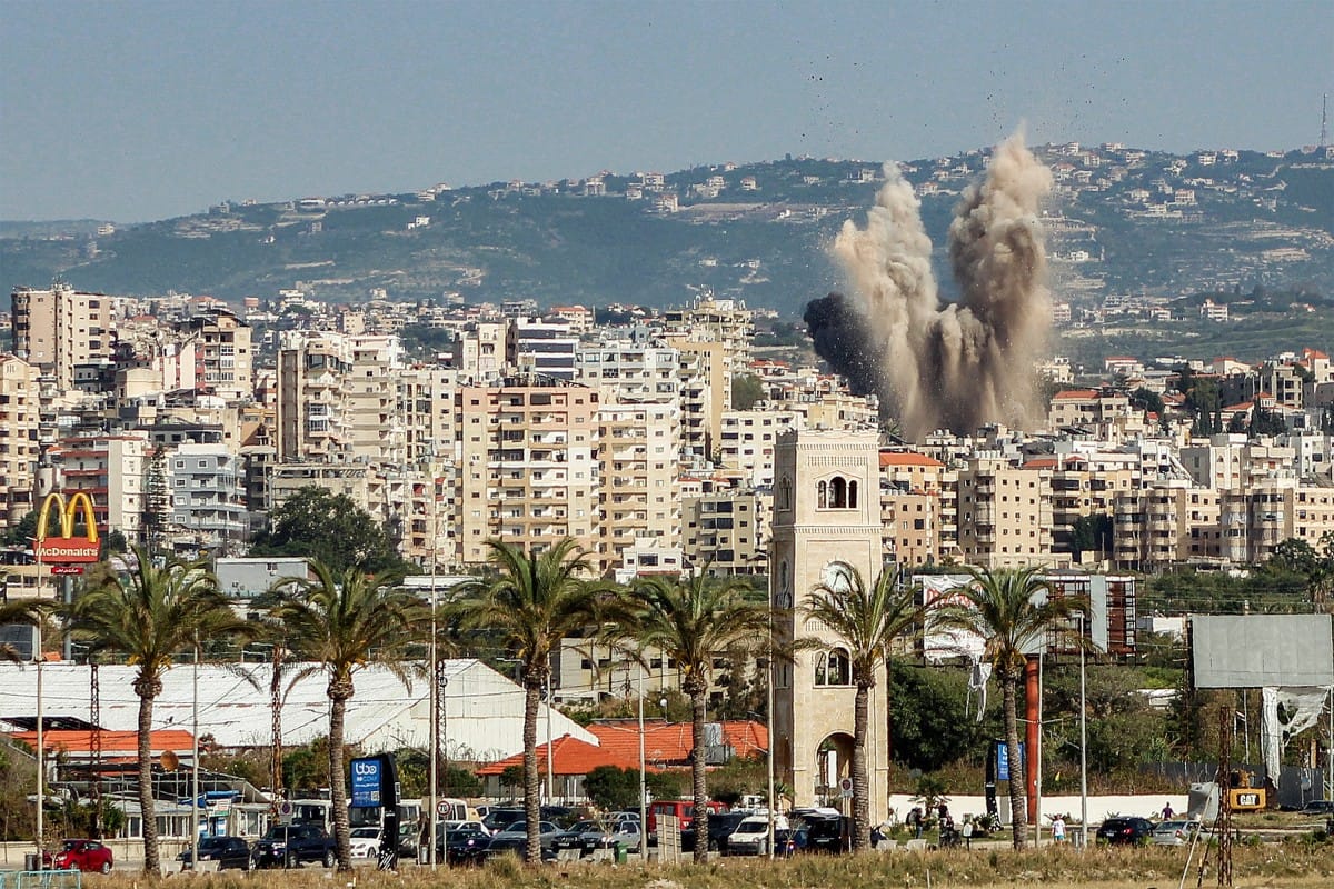An explosion erupts in the area of Al Housh following Israeli bombardment as seen from Tyre in southern lebanon on May 12, 2026.
