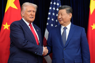 President Donald Trump, left, and Chinese President Xi Jinping shake hands before their meeting at Gimhae International Airport in Busan, South Korea, Oct. 30, 2025. 