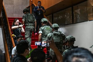 Troops arrive after the exchange of gunshots inside the Senate of the Philippines in Pasay, Metro Manila on May 13, 2026.