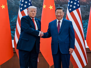 US President Donald Trump (L) shakes hands with China's President Xi Jinping at the Great Hall of the People in Beijing on May 14, 2026.