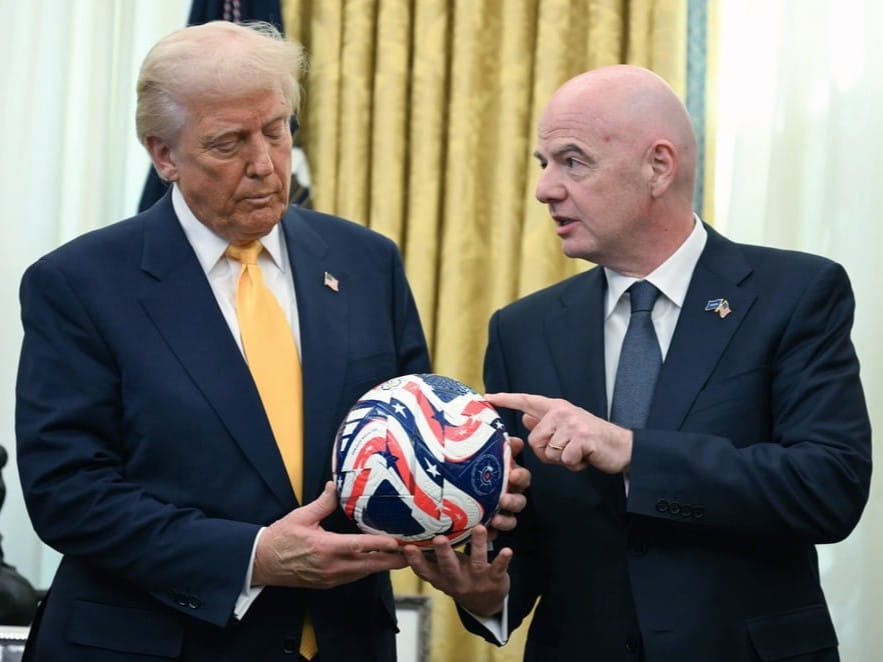 FIFA President Gianni Infantino, right, presents President Donald Trump with the new FIFA Club World Cup official ball in the Oval Office of the White House 